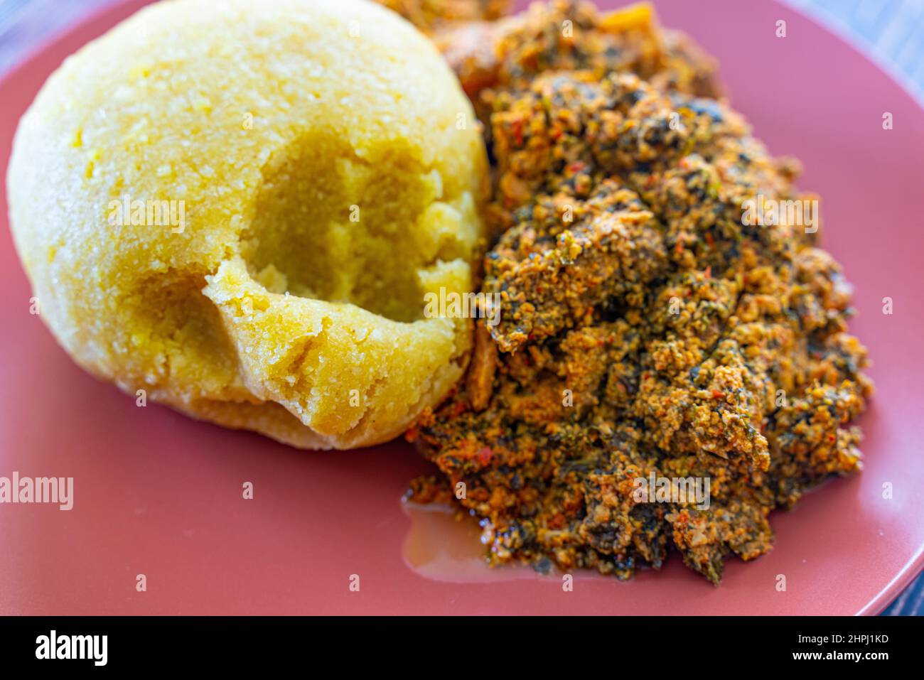 Nigerian Egusi Melon soup with garri eba for lunch Stock Photo Alamy