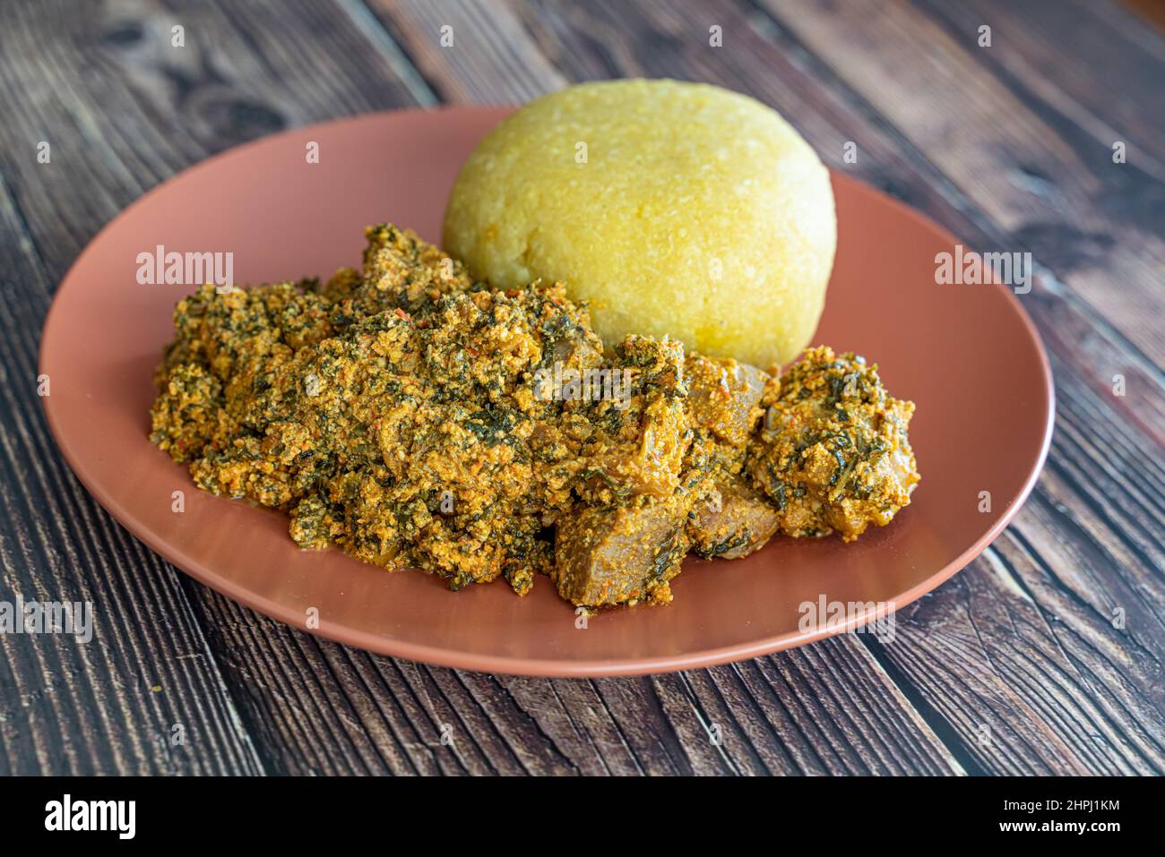 Nigerian Egusi Melon soup with garri eba for lunch Stock Photo Alamy