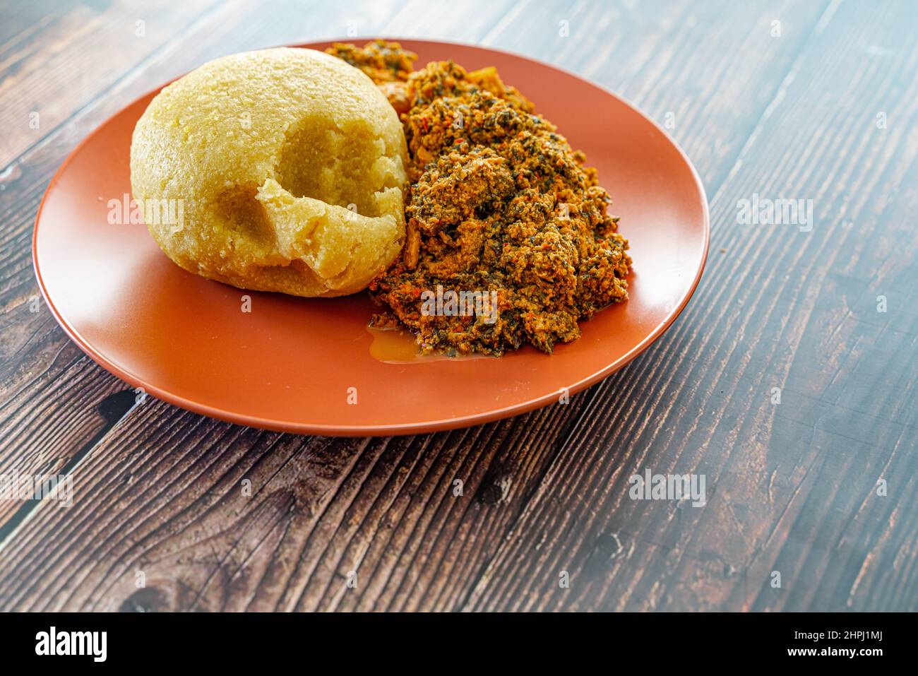 Nigerian Egusi Melon soup with garri eba for lunch Stock Photo Alamy