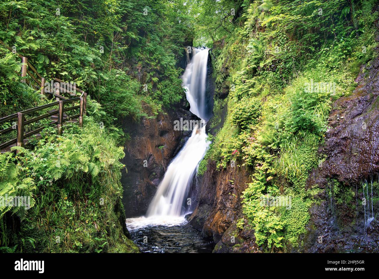 Ballymena, Northern Ireland, UK - July 18, 2020: Ess-Na-Laragh waterfall on Waterfall trail in Glenariff Forest Park. Stock Photo