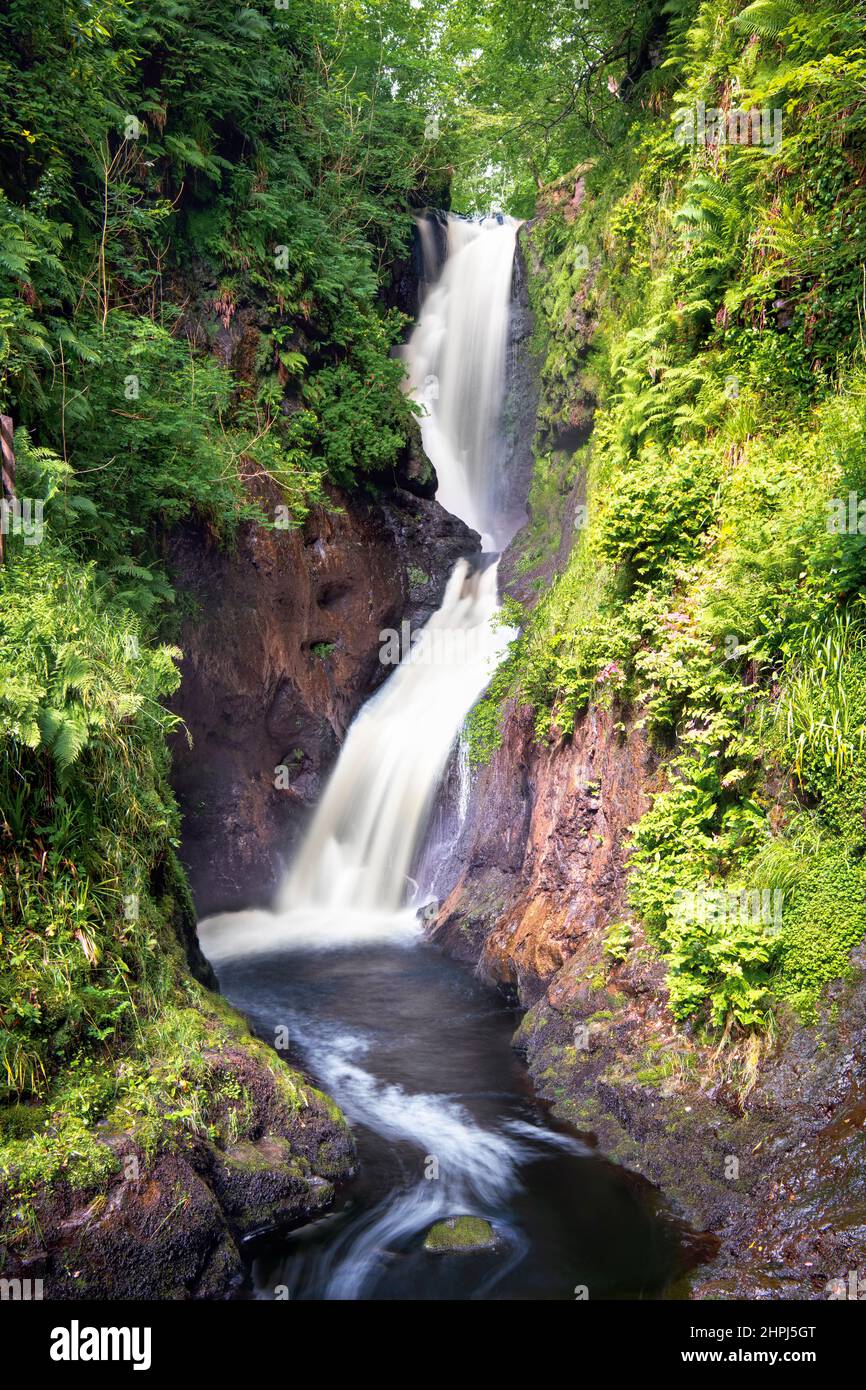 Ballymena, Northern Ireland, UK - July 18, 2020: Ess-Na-Laragh waterfall on Waterfall trail in Glenariff Forest Park. Stock Photo