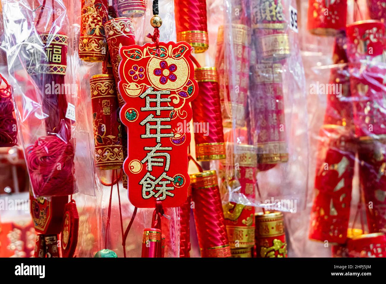 Chinese ornaments hung up in shops at market during Chinese New Year Stock Photo