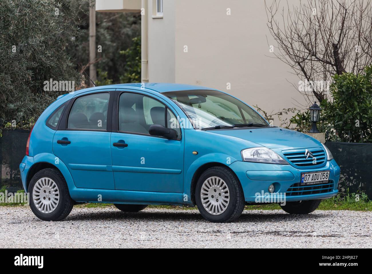 Side, Turkey – February 01 2022:   blue  Citroën C2  is parked  on the street on a warm summer day against the backdrop of a buildung, street Stock Photo