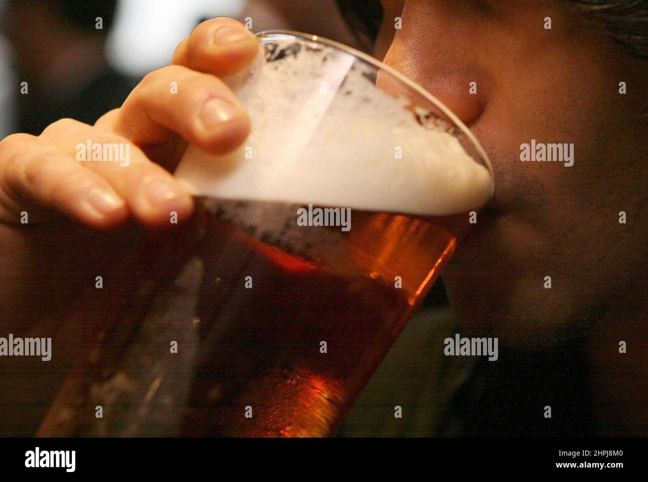 File photo dated 01/12/06 of a man drinking a pint of beer. Deaths wholly linked to alcohol increased in Scotland since before the pandemic, despite consumption decreasing in general, new Public Health Scotland (PHS) figures have found. Issue date: Tuesday February 22, 2022. Stock Photo