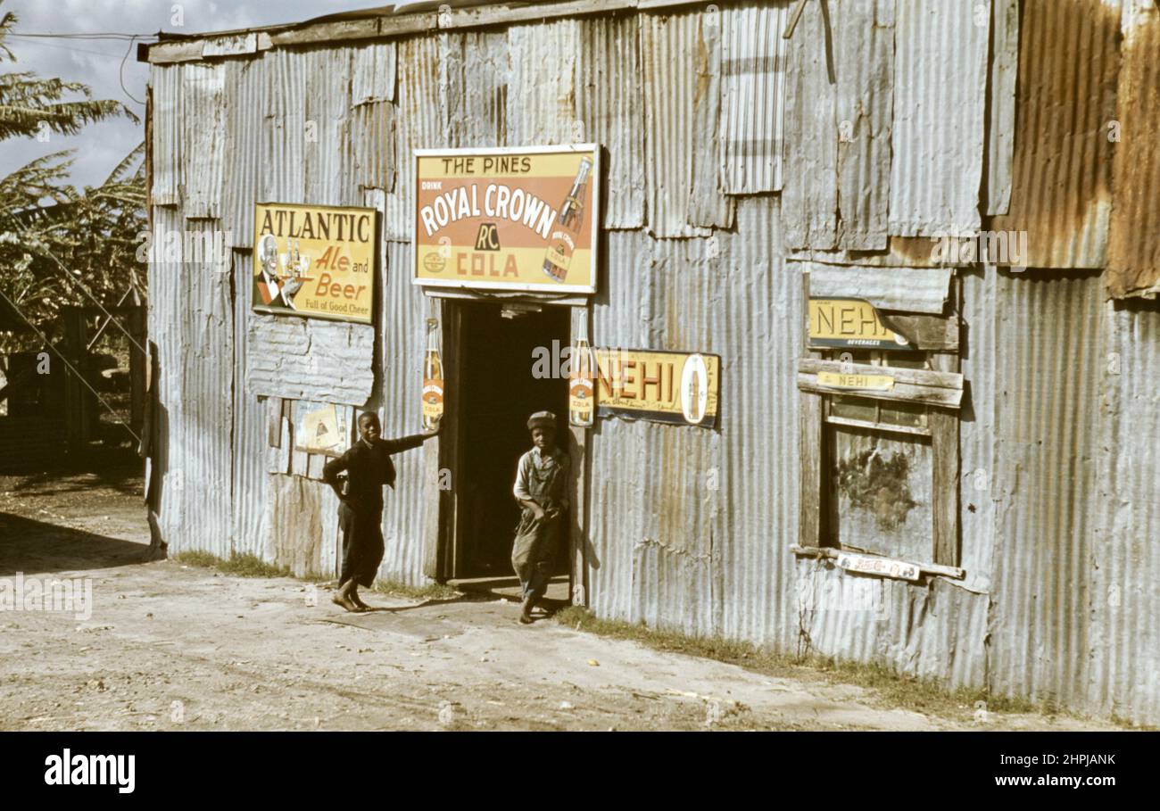 Marion Post Wolcott - Migratory workers juke joint with advertisements for Atlantic Ale and Beer, Royal Crown Cola and Nehi- 1941 Stock Photo
