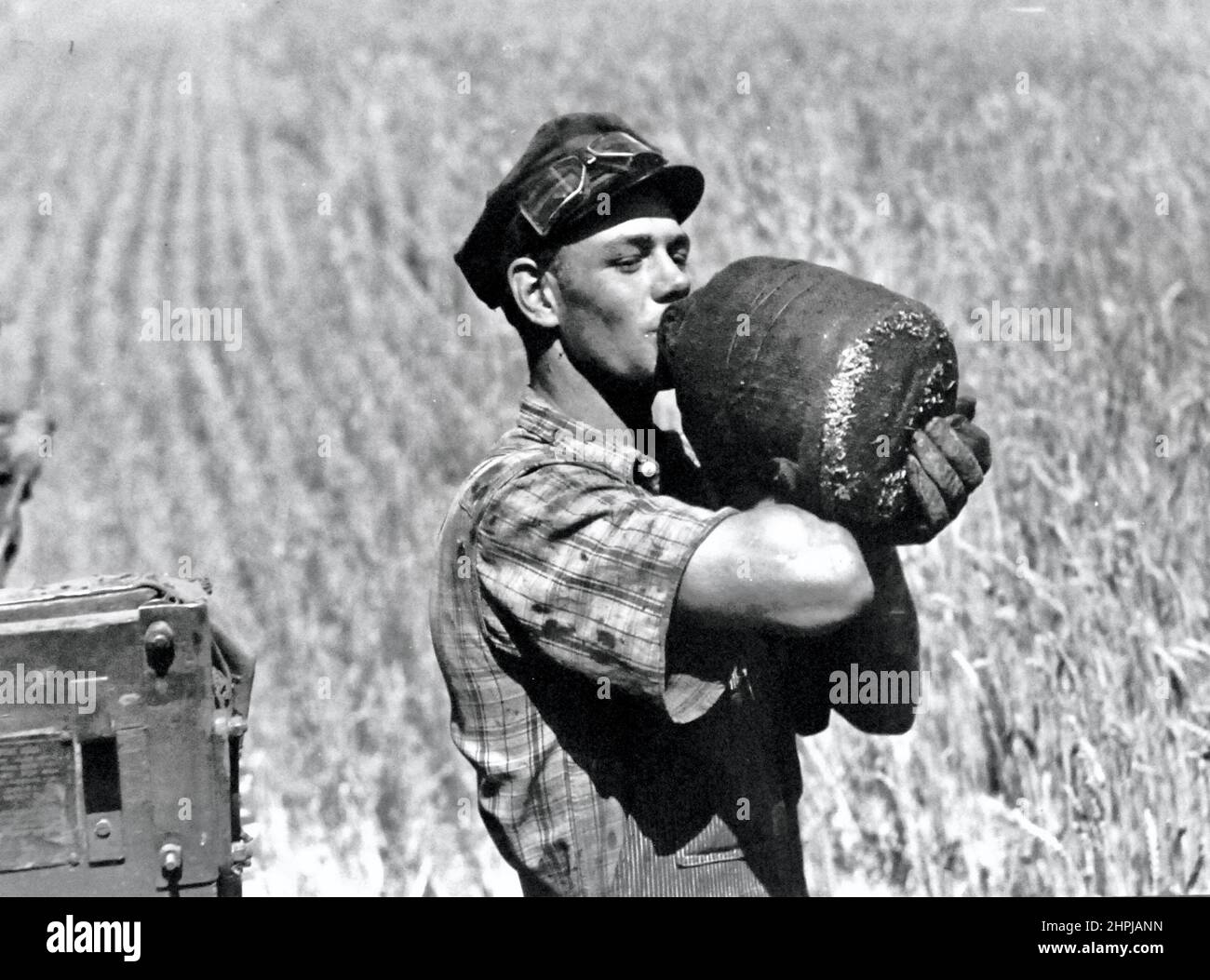 Marion Post Wolcott - Tractor driver quenching his thirst - 1941 Stock Photo