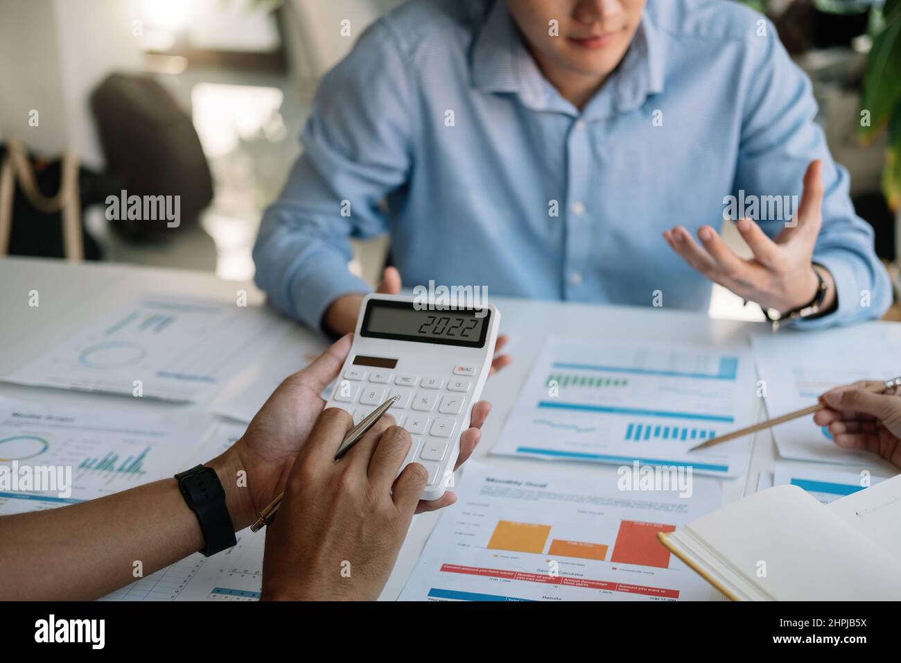 Group of business people analysis summary graph reports of business operating expenses and work data about the company's financial statements with Stock Photo