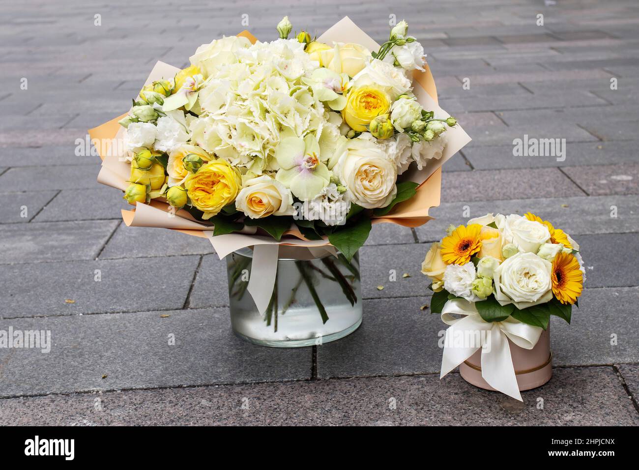 Wedding bouquet of yellow roses, white hydrangea, pink tulips and