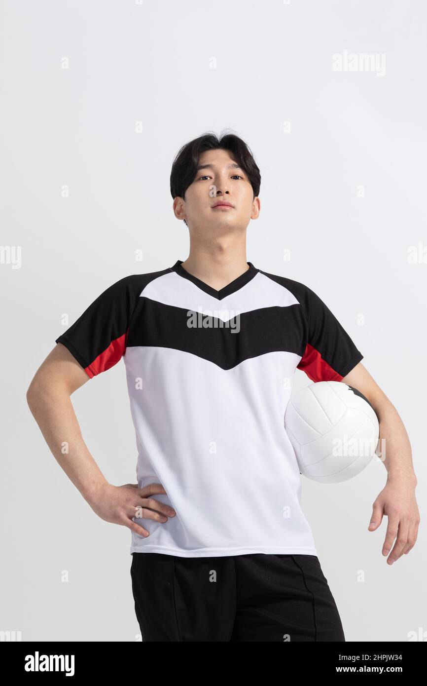 volleyball sports player, asian korean man holding ball Stock Photo