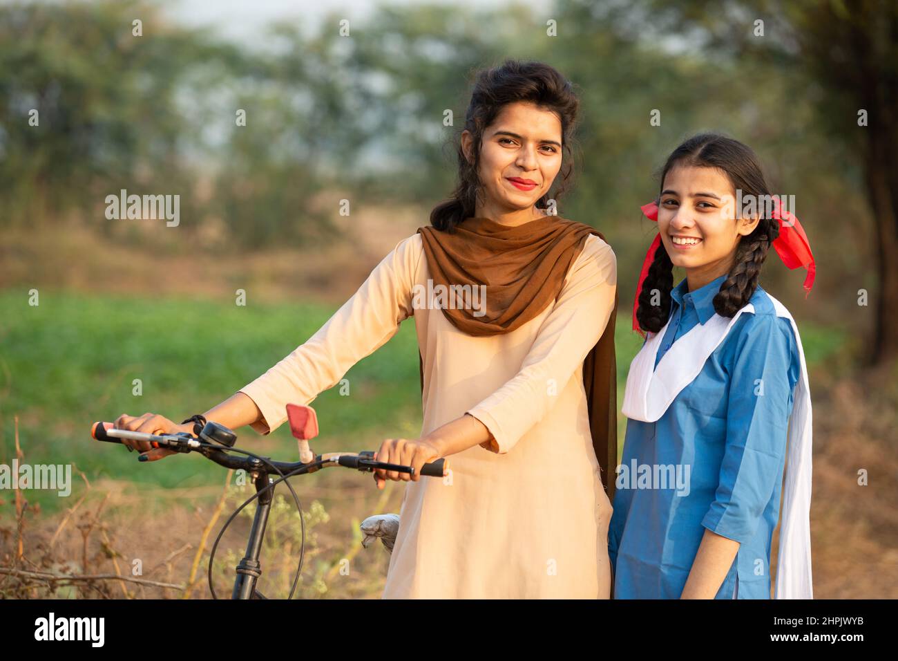 Portrait of happy young rural indian girls wearing school uniform