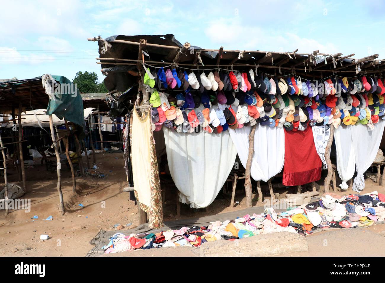 Clothes and caps are displayed for sale on the highway in Chikwawa