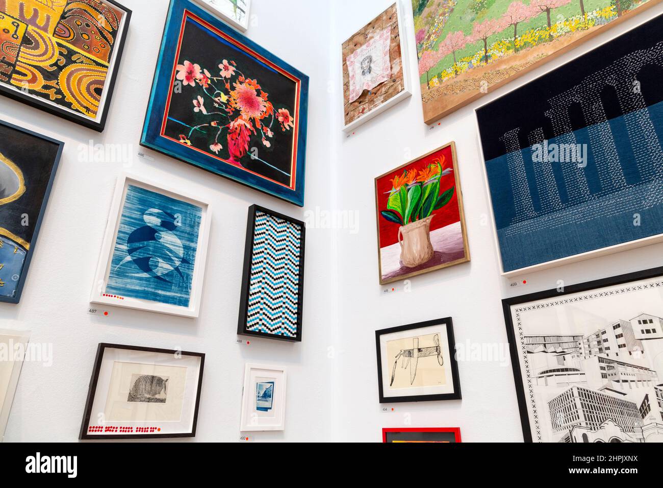 Selection of artworks on the wall at the RA Summer Exhibition 2021, London, UK Stock Photo