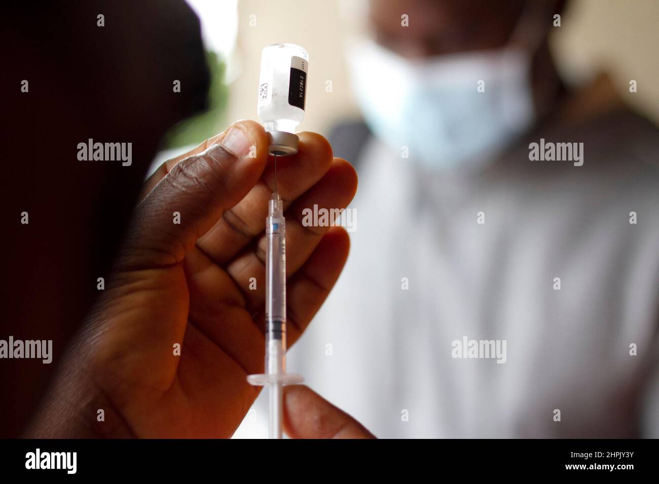 A health worker prepares to administer Covid-19 Vaccine in Lilongwe, Malawi. Stock Photo