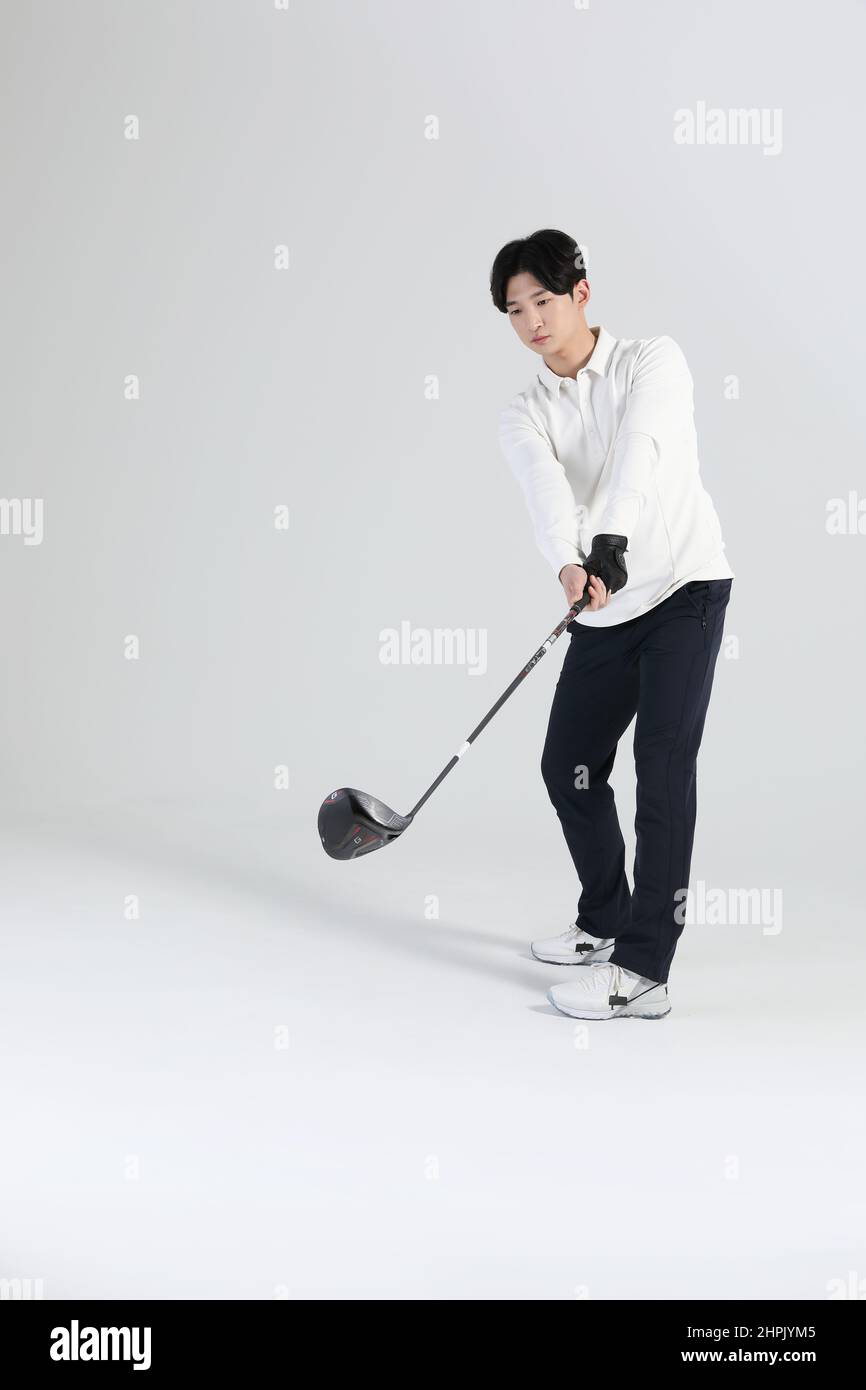 golf sports player, asian korean man with golf club in studio Stock