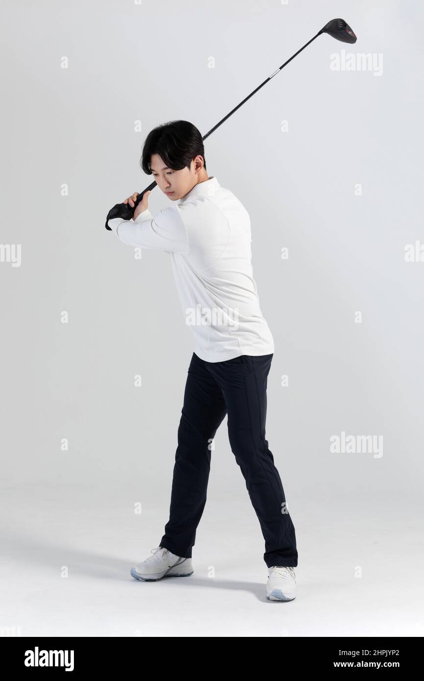golf sports player, asian korean man with golf club in studio Stock