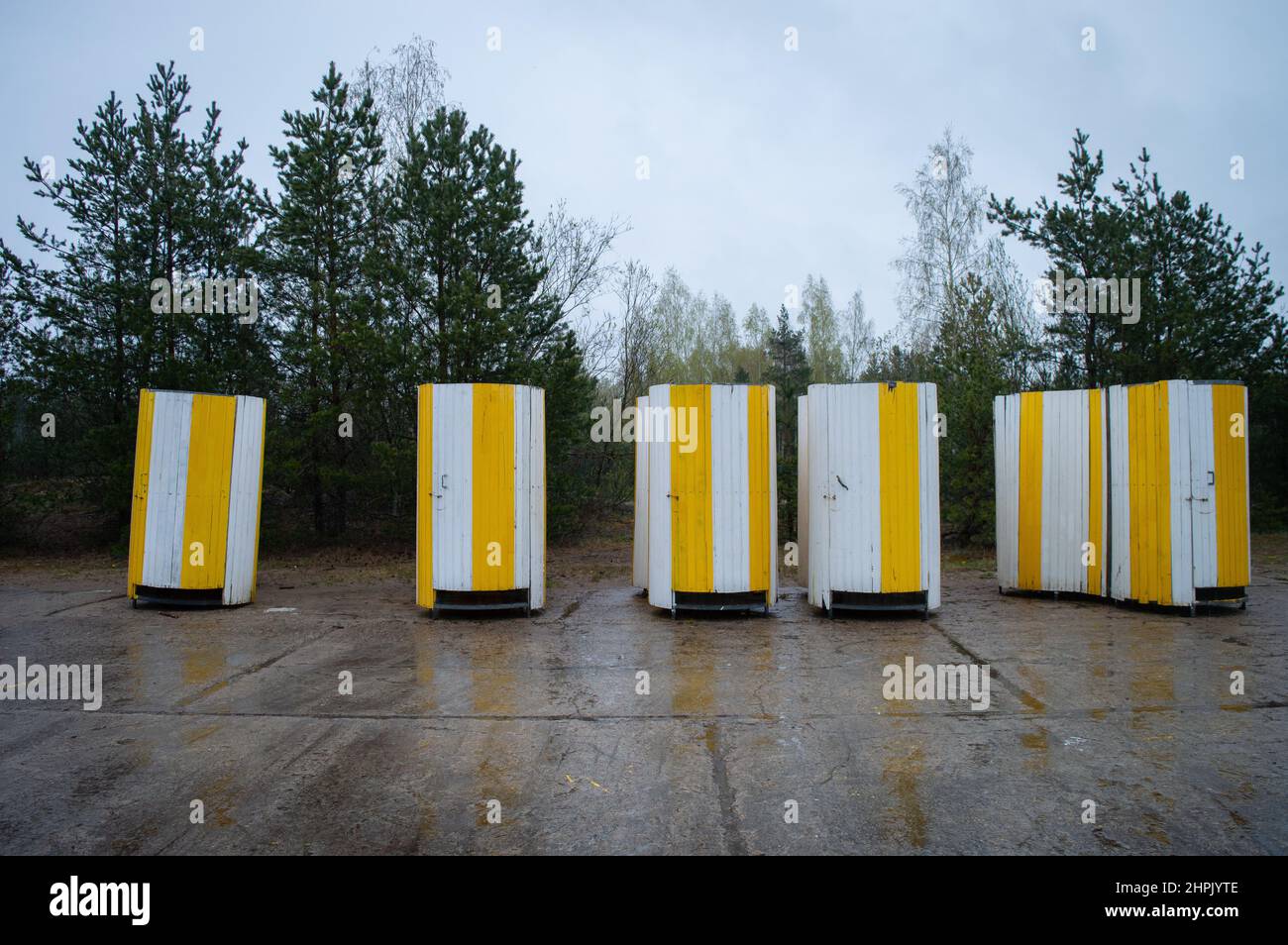 Strand toilets. Yellow movable strand toilets in a row. Mockup friendly Stock Photo