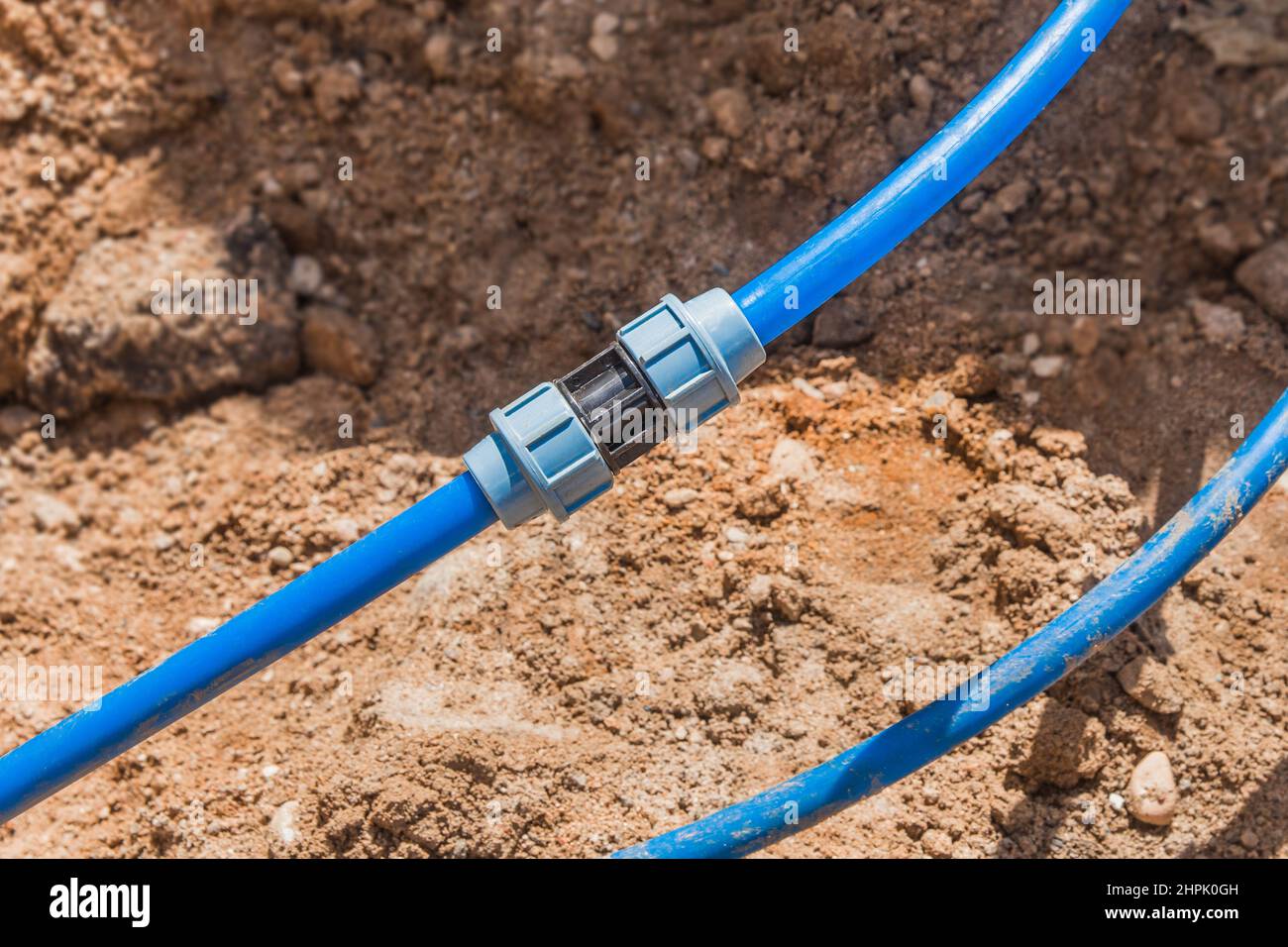 Installation and quick-disconnect connection of polyethylene water pipes of water supply. Stock Photo