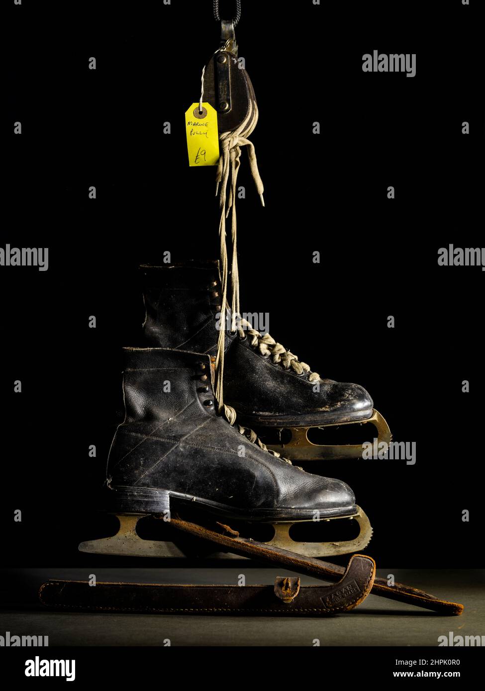 Pair of vintage Ice Skates with leather boots and blade guards