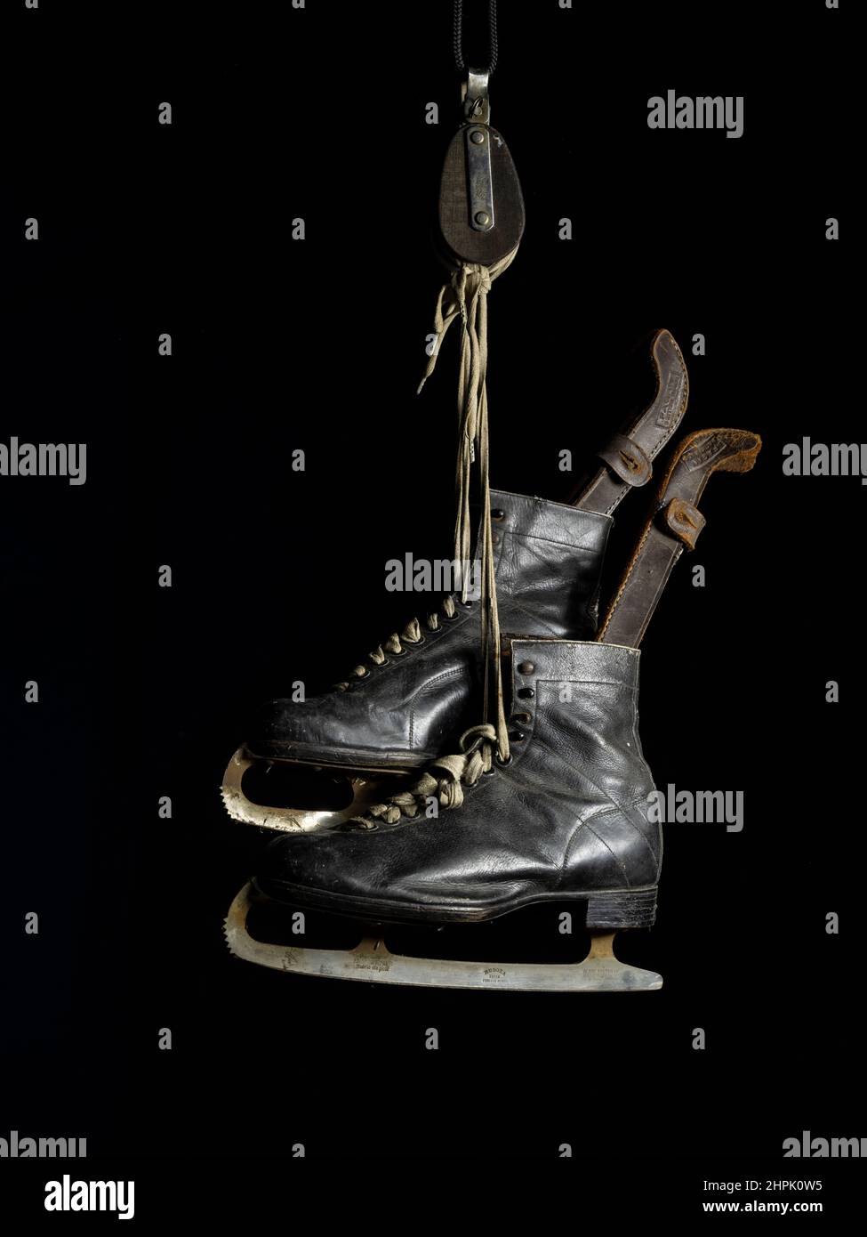 Pair of vintage Ice Skates with leather boots and blade guards