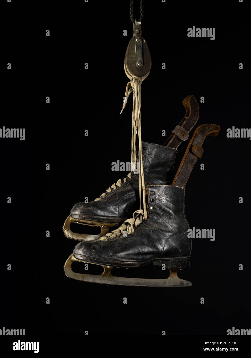 Pair of vintage Ice Skates with leather boots and blade guards