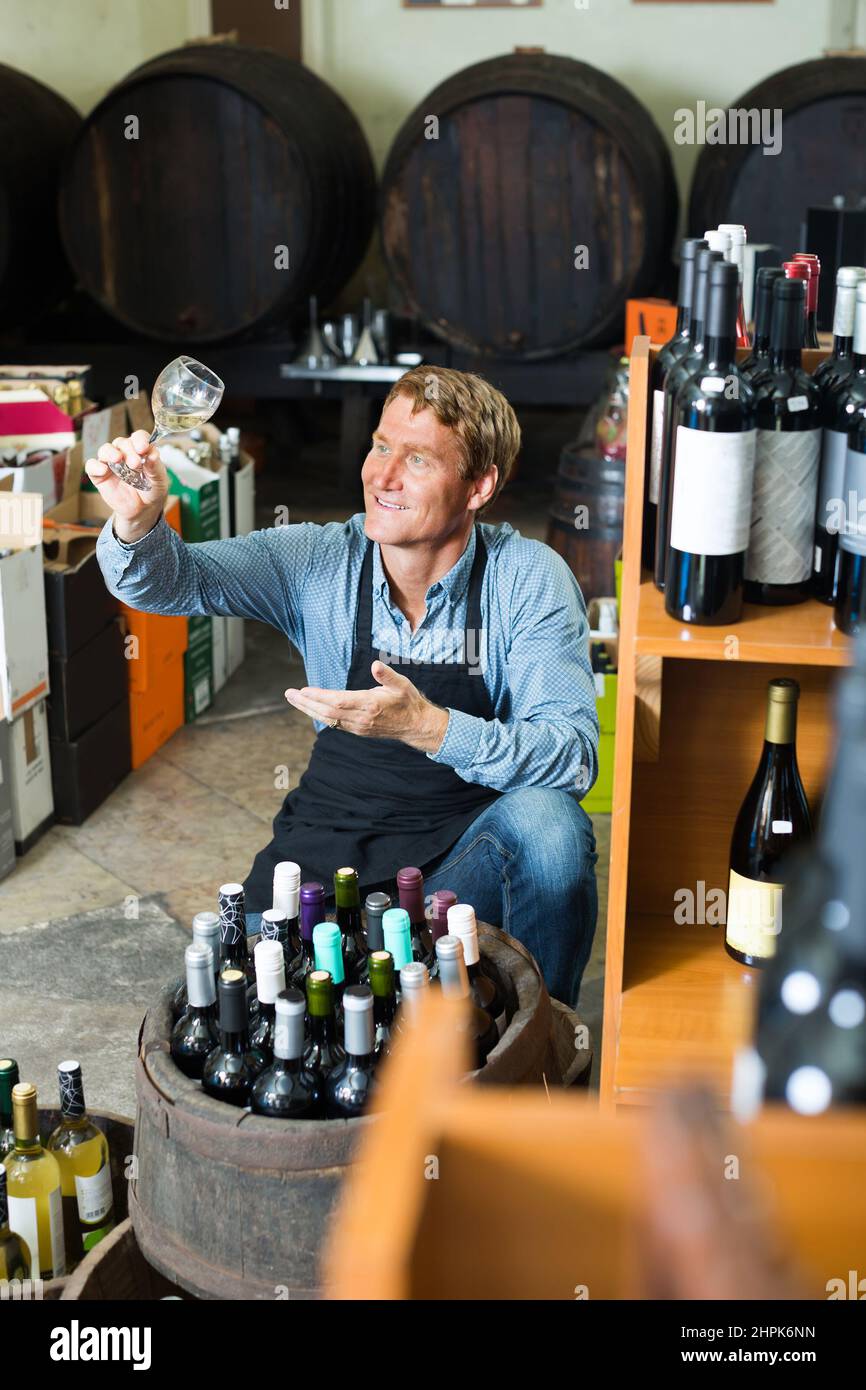Man selecting bottle of wine cellar hi-res stock photography and images ...