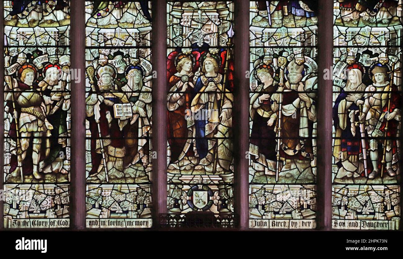 Stained glass window by Percy Bacon & Brothers depicting saints and angels St. Peter and St. Paul's Church, Watlington, Norfolk Stock Photo