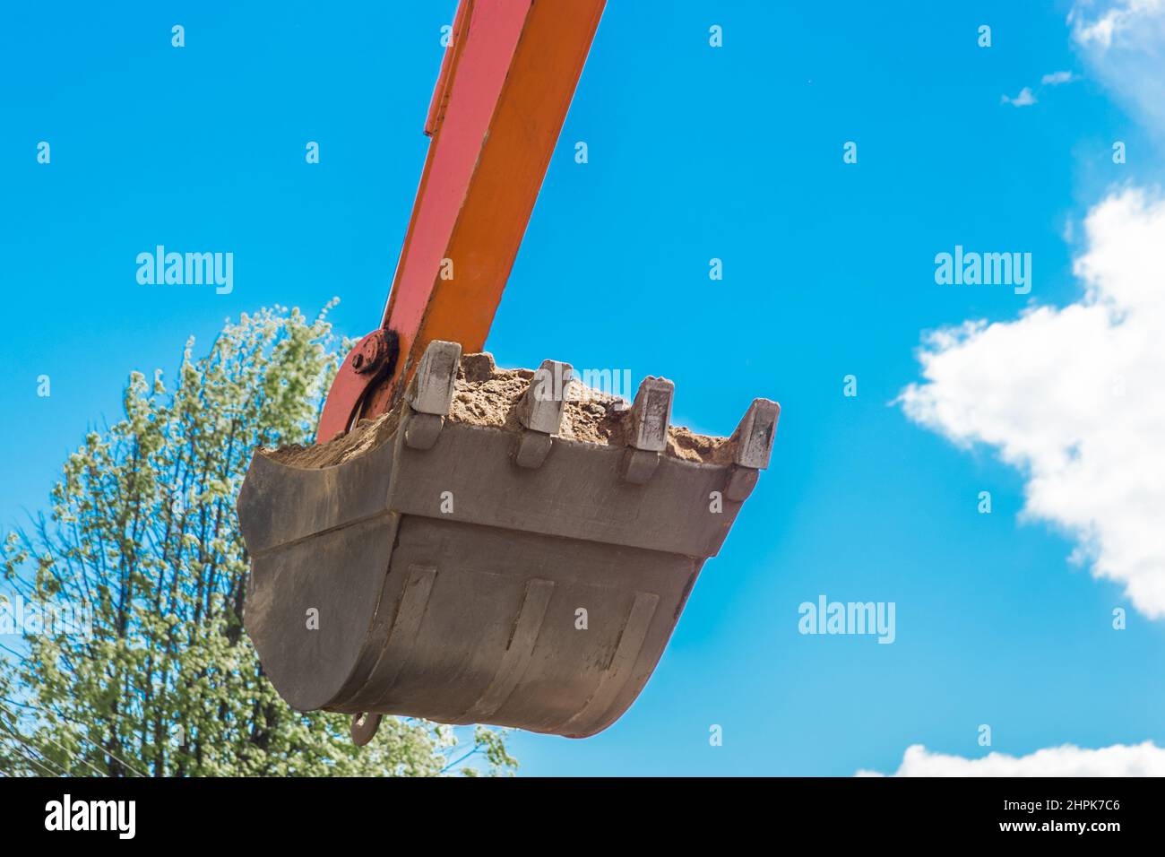 Excavation works. Tractor bucket digging the ground on a construction