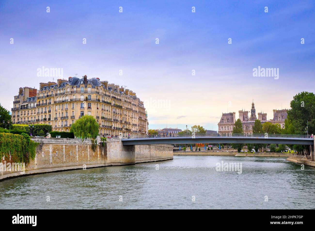 View of the embankment of the River Seine in the evening, the historic quarters of Paris Stock Photo