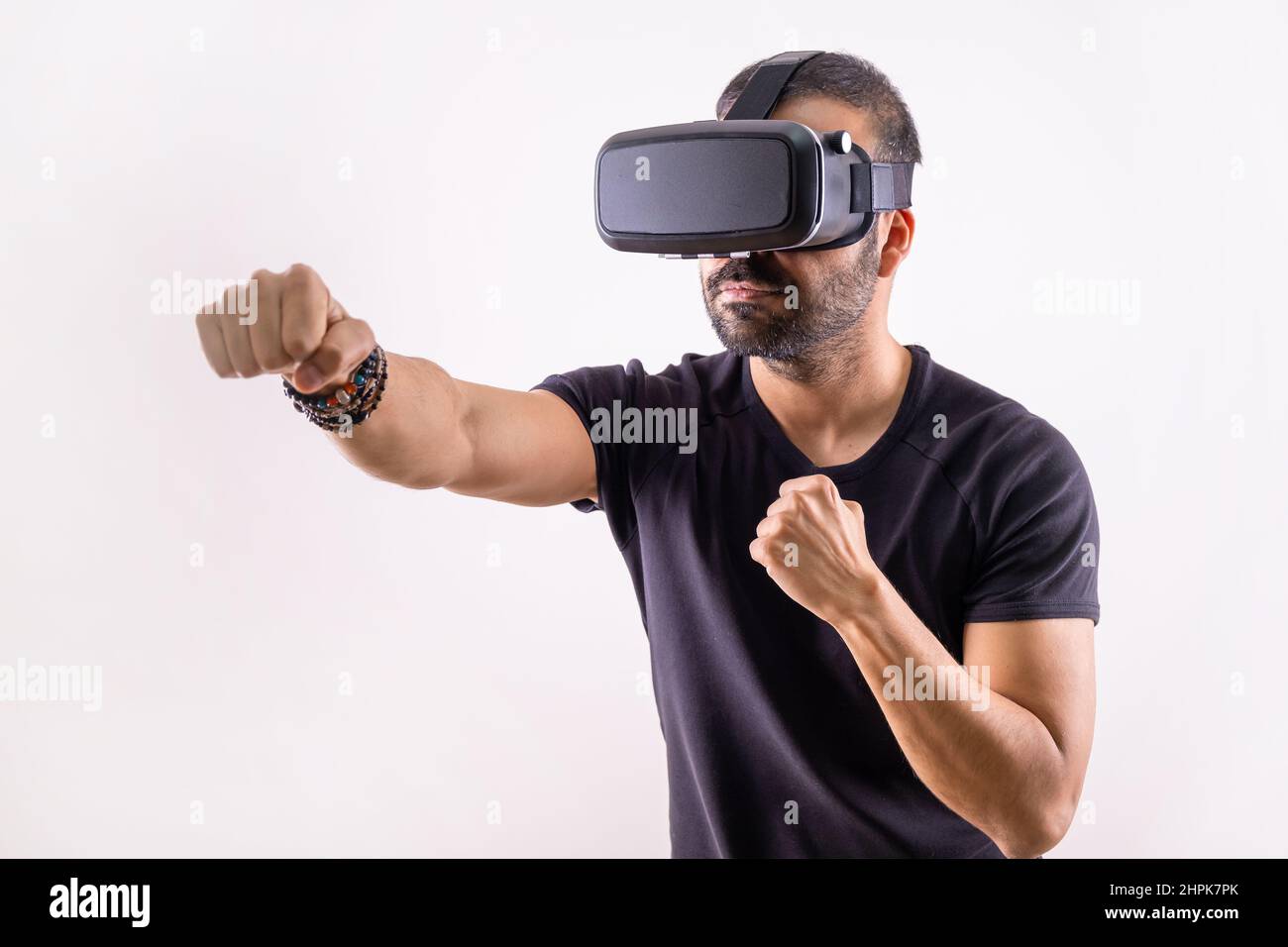 Virtual reality workout, sport game. young man with VR glasses boxing. Smart sport technology