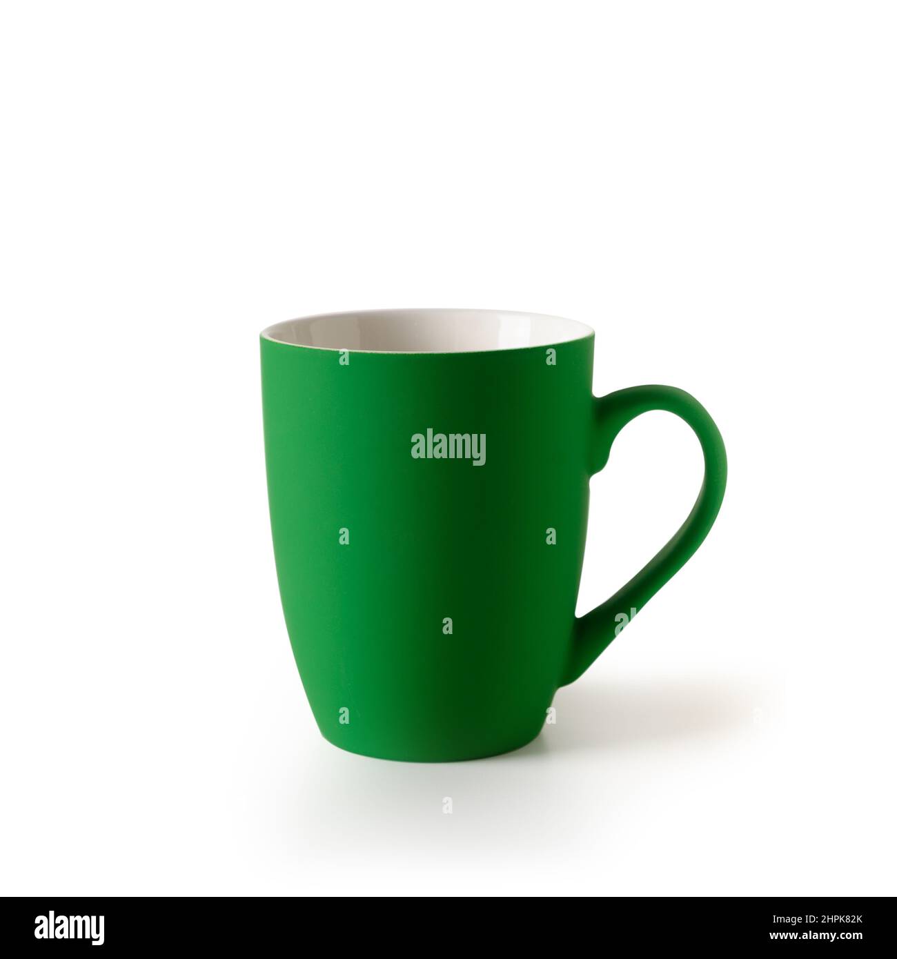 Green empty coffee or tea cup isolated on a white background. Patrick day celebration. Stock Photo