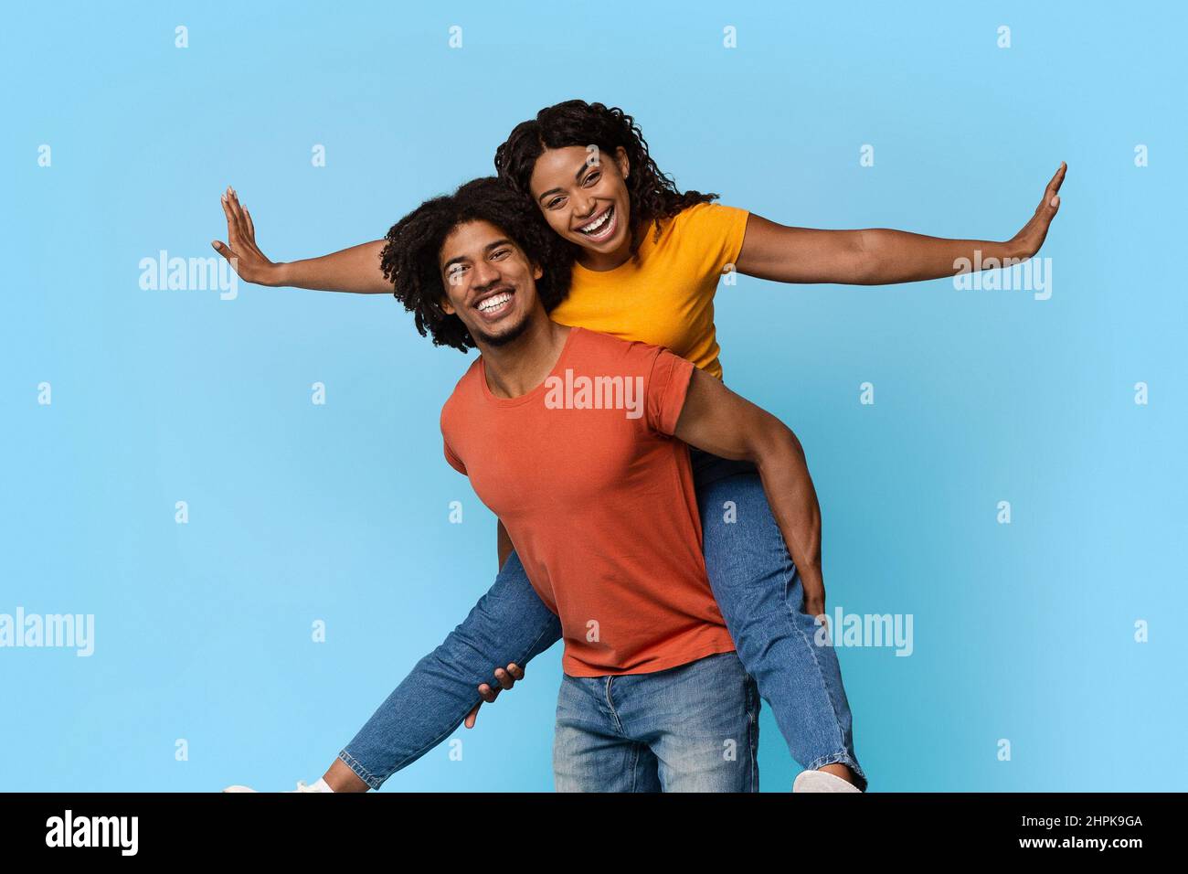 Pretty african american woman riding her lover back Stock Photo