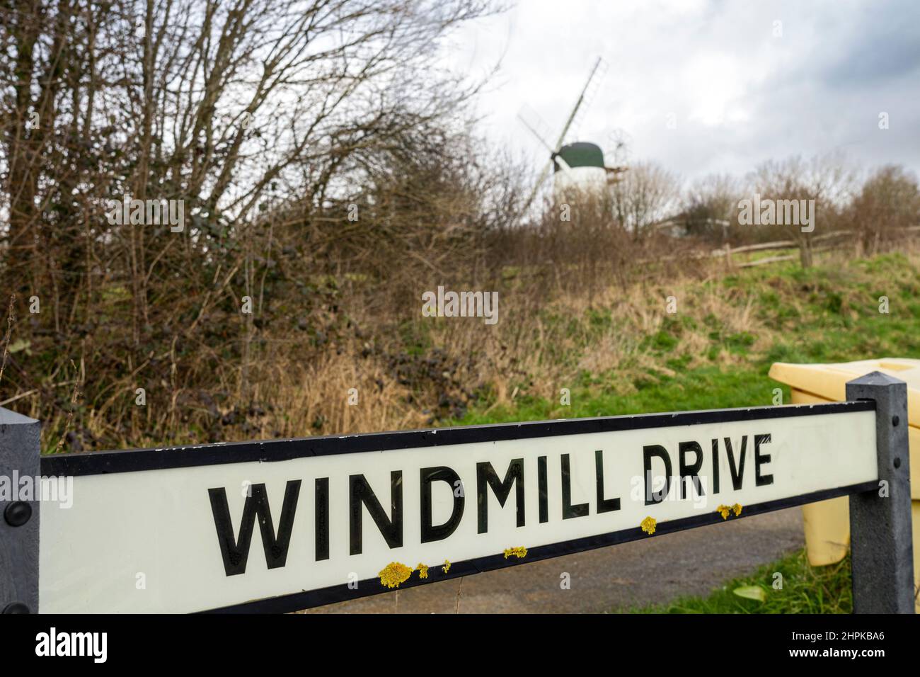 Road name sign and windmill Stock Photo