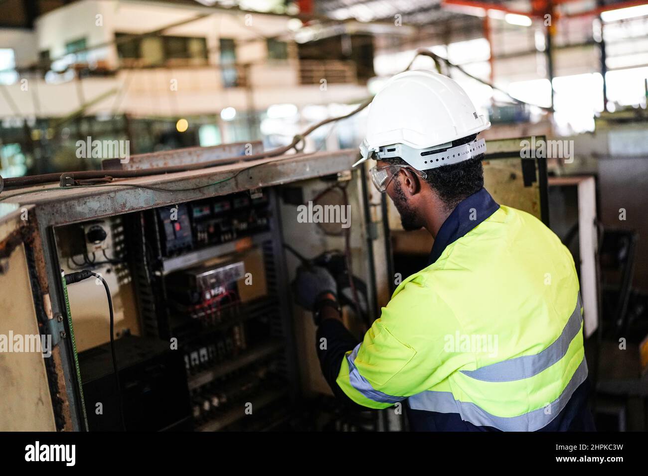 Factory Engineer Operating machines in industry factory Stock Photo - Alamy