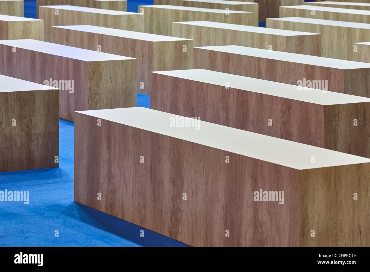 Wooden seats on a conference indoor hall. Empty place Stock Photo