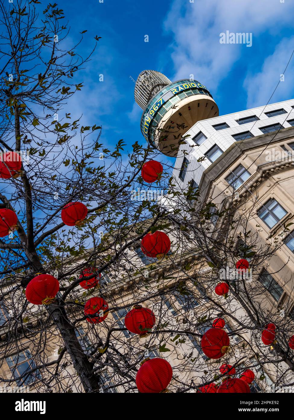 Liverpool Radio City Tower,  known as St John's Beacon, with Chinese New Year lanterns hanging from a winter tree. Stock Photo