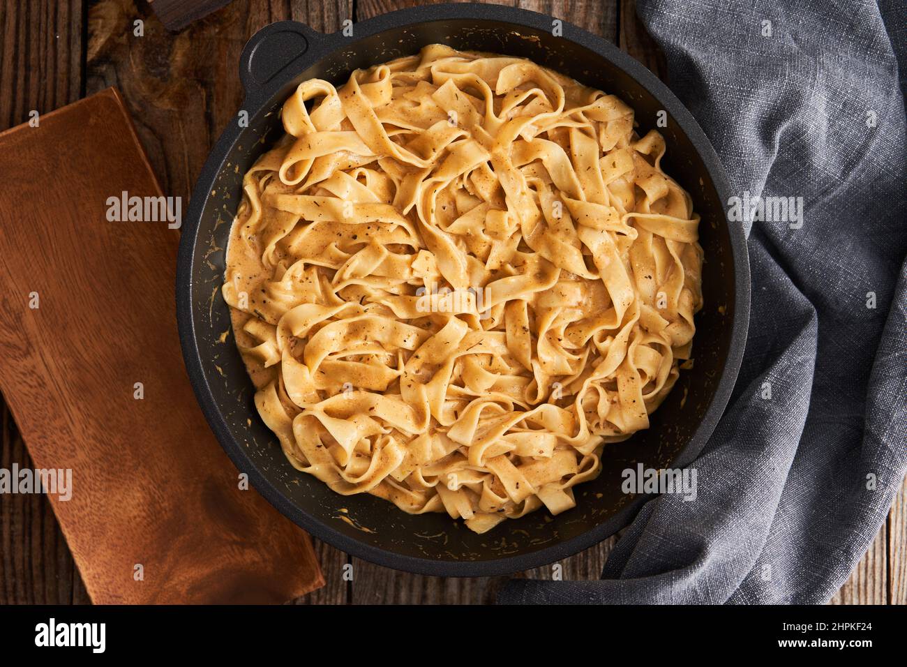 Closeup of fettuccine pasta in Alfredo sauce as garnish for chicken Stock Photo Alamy