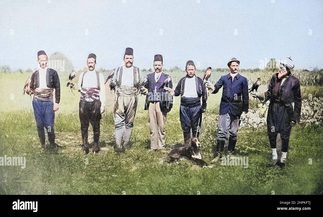 Machine Colorized Bosnian Falconers from the book ' The living races of mankind ' a popular illustrated account of the customs, habits, pursuits, feasts & ceremonies of the races of mankind throughout the world by Sir Harry Hamilton Johnston, and Henry Neville Hutchinson Published in London by Hutchinson & Co. in 1902 Stock Photo