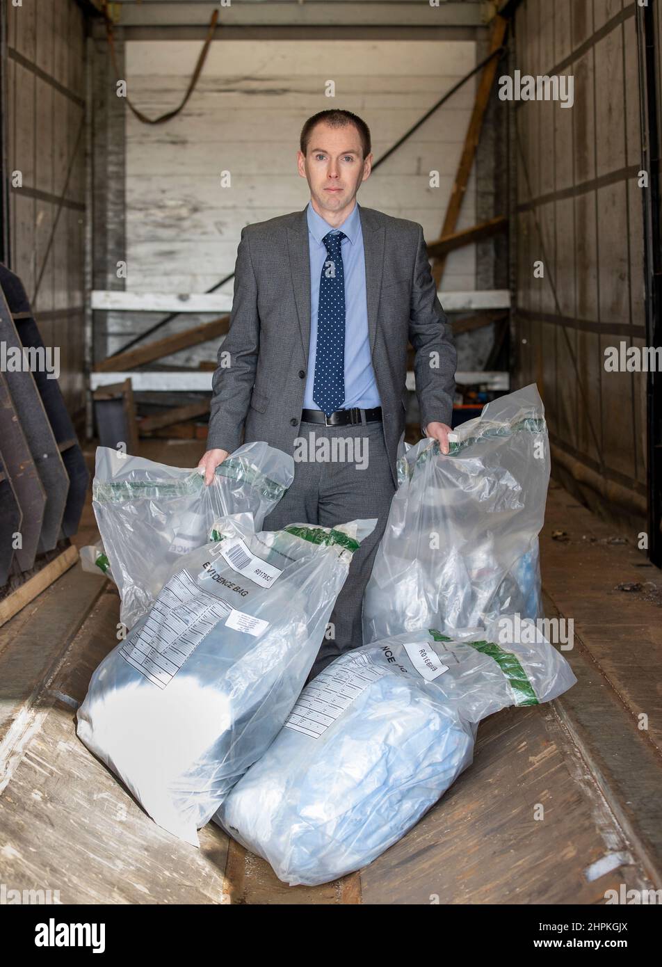 Police Service of Northern Ireland (PSNI) Detective Inspector Conor Sweeney of the Organised Crime Task Force at location in Greater Belfast, showing part of a £3 million drug seizure that was intercepted at Belfast Harbour. The find is one of Northern Ireland's largest recorded. Stock Photo
