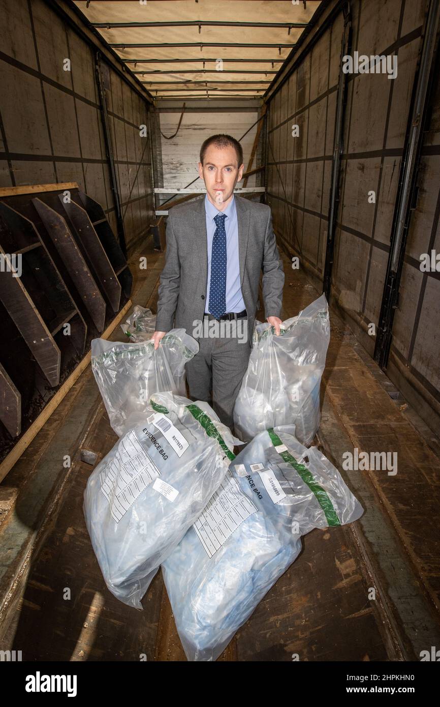 Police Service of Northern Ireland (PSNI) Detective Inspector Conor Sweeney of the Organised Crime Task Force at a location in Greater Belfast, showing part of a £3 million drug seizure that was intercepted at Belfast Harbour. The find is one of Northern Ireland's largest recorded. Stock Photo