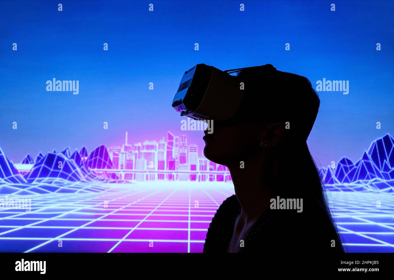 the silhouette of Female person using Virtual reality headset in