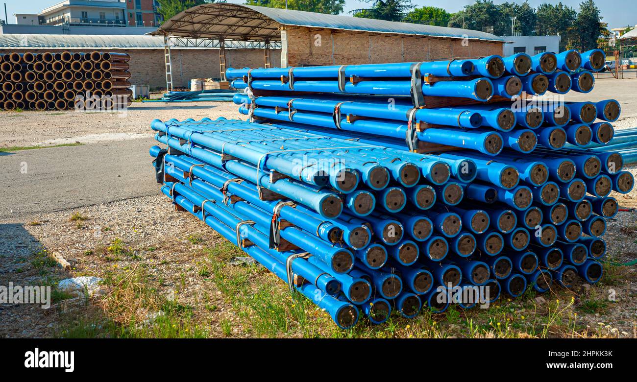 stacked tubes in spheroidal cast iron with coating in applied zinc metal, finished with a layer of bituminous paint Stock Photo