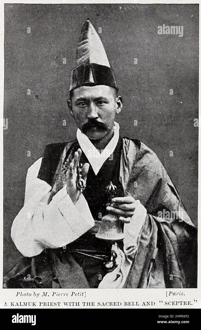 A KALMUK PRIEST WITH THE SACRED BELL AND SCEPTRE The Kalmyks (Calmucks) are a Mongolian subgroup in Russia and Kyrgyzstan, whose ancestors migrated from Dzungaria. They created the Kalmyk Khanate from 1635 to 1779 in Russia's North Caucasus territory. Today they form a majority in Kalmykia, located in the Kalmyk Steppe, on the western shore of the Caspian Sea. from the book ' The living races of mankind ' a popular illustrated account of the customs, habits, pursuits, feasts & ceremonies of the races of mankind throughout the world by Sir Harry Hamilton Johnston, and Henry Neville Hutchinson V Stock Photo
