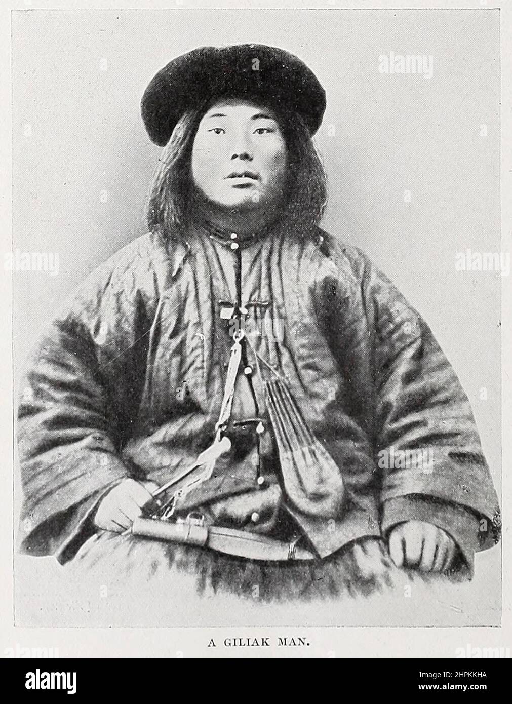 A Giliak man The Nivkh, or Gilyak (also Nivkhs, or Gilyaks) are an indigenous ethnic group inhabiting the northern half of Sakhalin Island and the lower Amur River and coast on the adjacent Russian mainland and historically possibly parts of Manchuria. from the book ' The living races of mankind ' a popular illustrated account of the customs, habits, pursuits, feasts & ceremonies of the races of mankind throughout the world by Sir Harry Hamilton Johnston, and Henry Neville Hutchinson Volume 2 Published in London by Hutchinson & Co. in 1902 Stock Photo