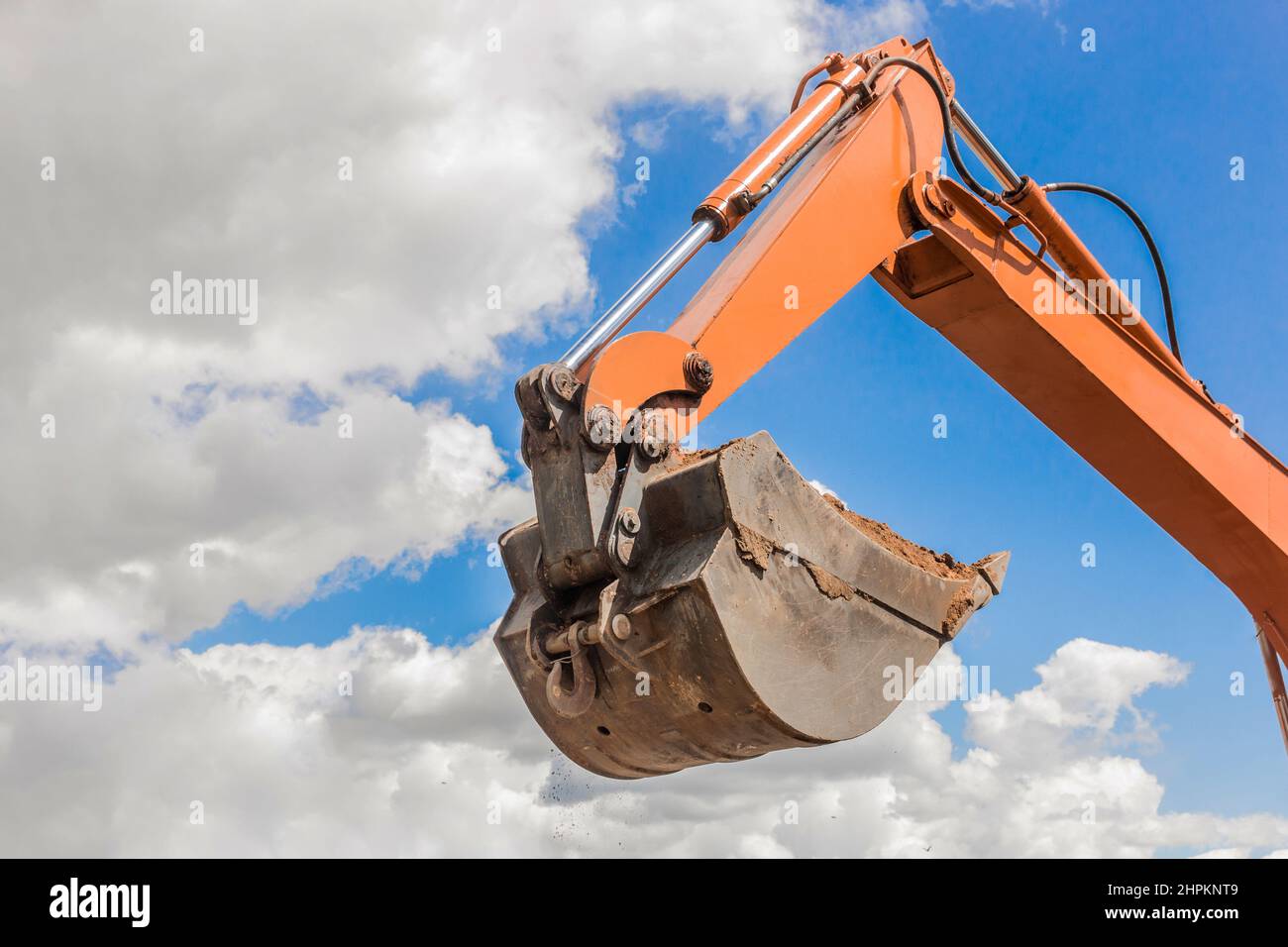 Excavation works. Tractor bucket digging the ground on a construction