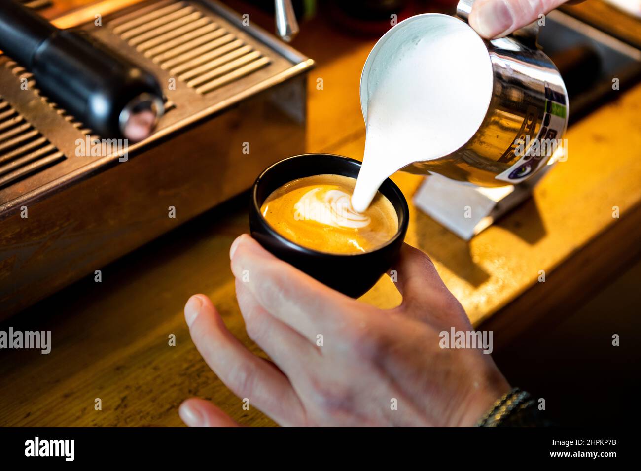 Barista making coffee latte Stock Photo Alamy