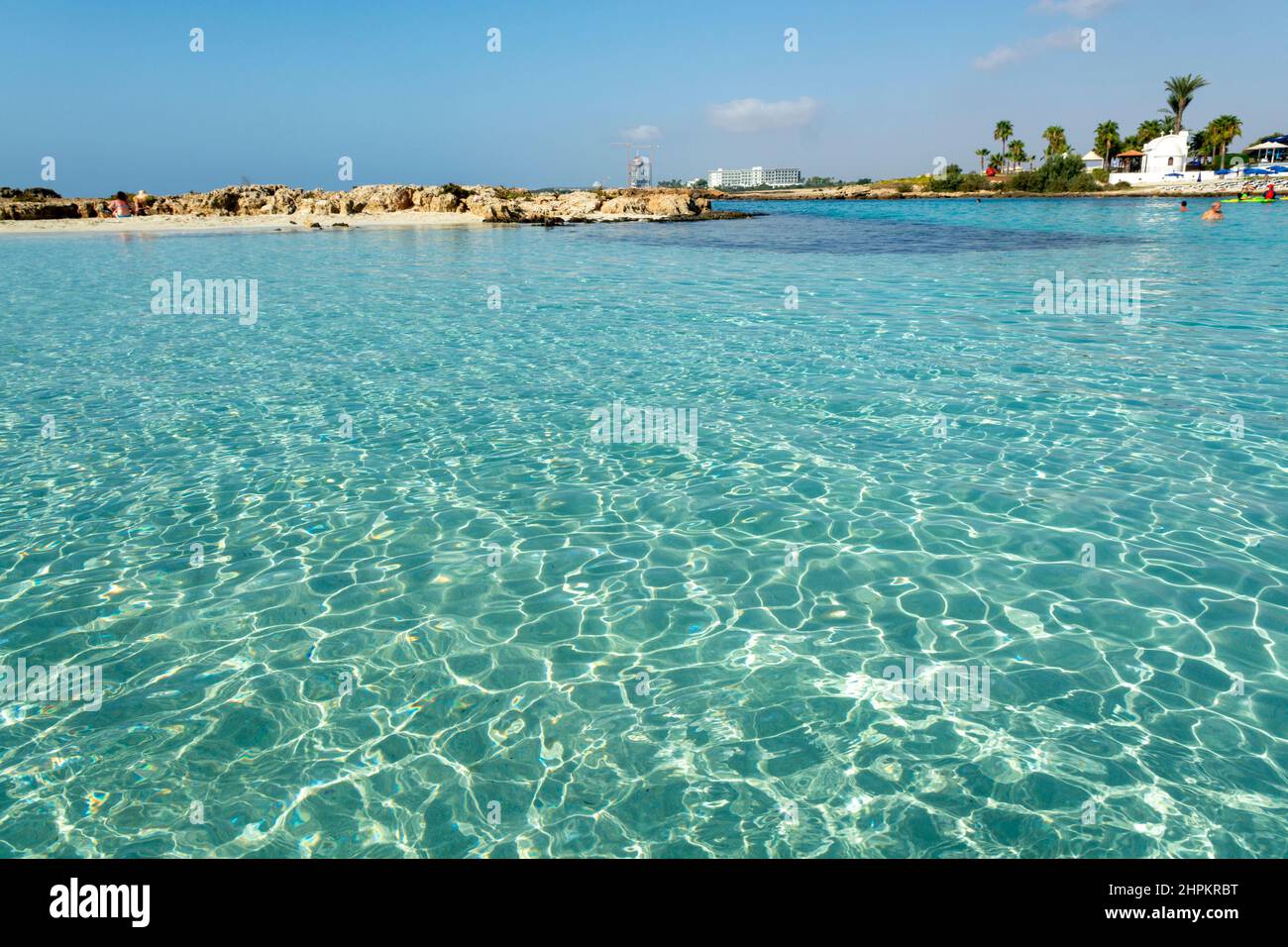 Crystal clear blue water of Mediterranean sea on white sandy Nissi beach in Ayia Napa, Cyprus