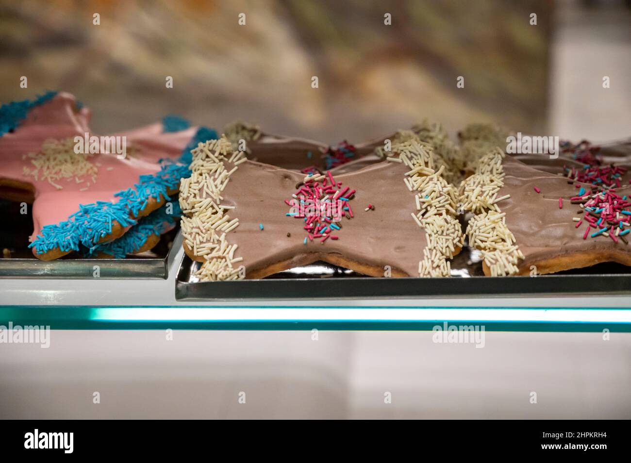 Sweet colorful bowshaped biscuits on display at Italian bakery Stock