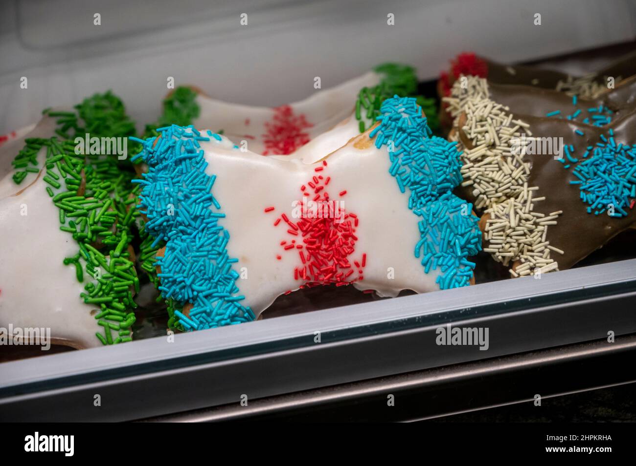 Sweet colorful bowshaped biscuits on display at Italian bakery Stock