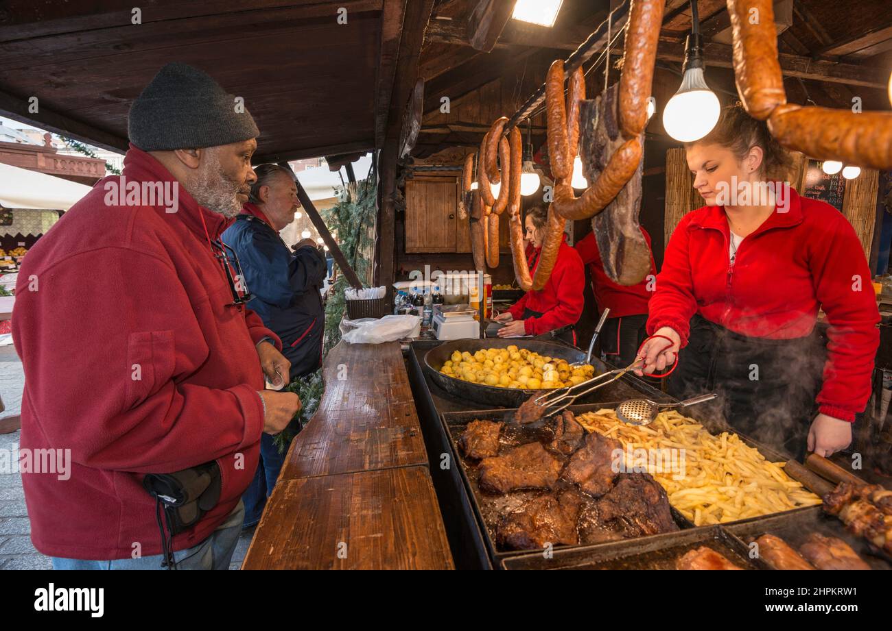 Food stand at Christmas market, Main Market Square, Kraków, Poland Stock Photo