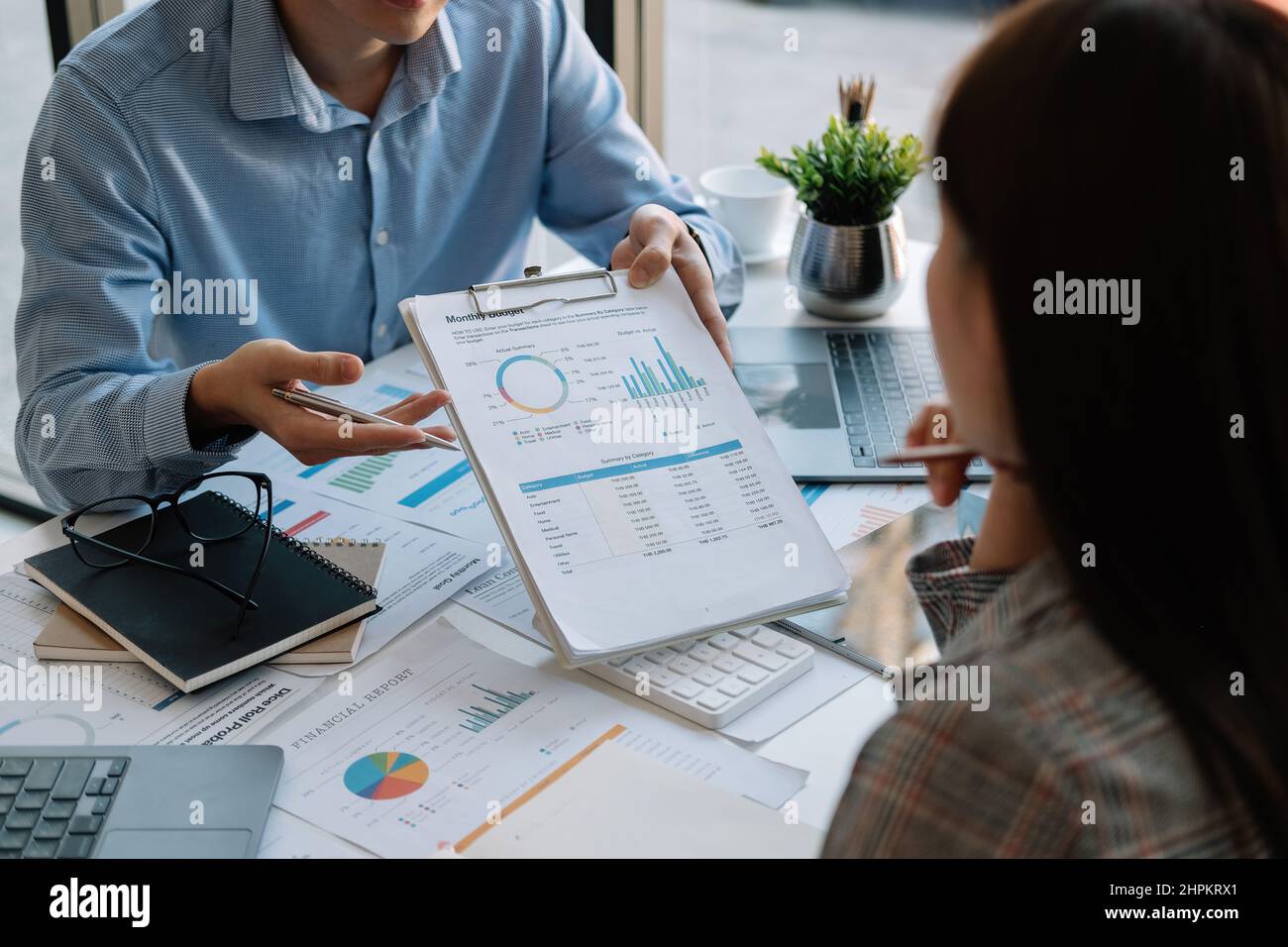 Business team meeting present, investor colleagues discussing new plan financial graph data on office table with laptop and digital tablet, Finance Stock Photo
